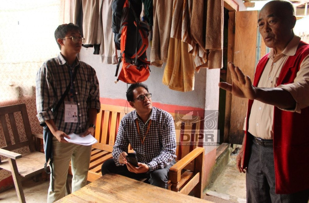 Dr Manoj Jain, Joint Director, ORGI, New Delhi interacting with the heads of the houses at Touphema village on July 16. (DIPR Photo)